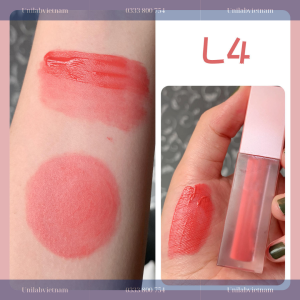 Hand holding a pink cosmetic sponge.